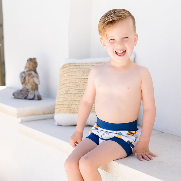 Toddler wearing a swim diaper in boats print